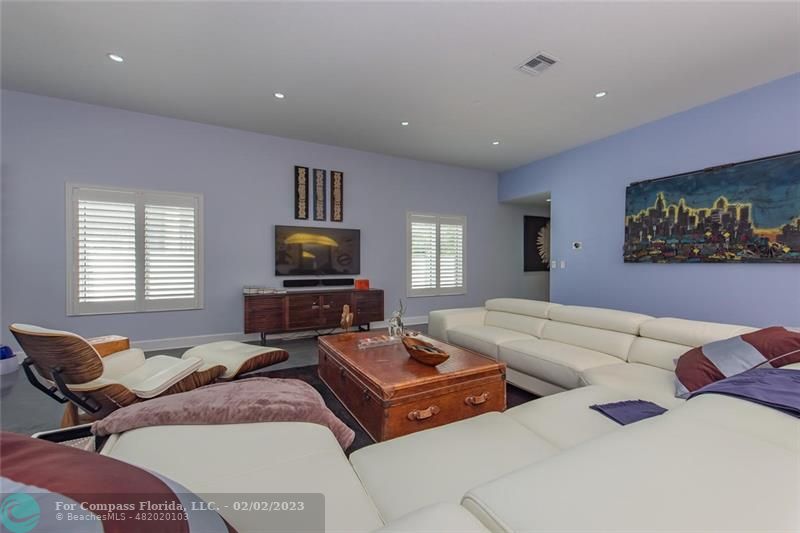 930 Northwest 4th Court Boca Raton, FL 33432 - Photo 11 of 28 a living room with furniture and a flat screen tv