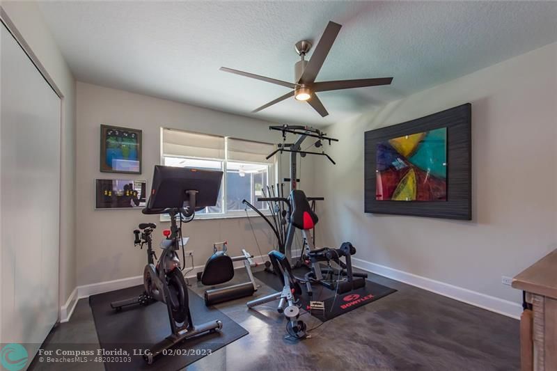 930 Northwest 4th Court Boca Raton, FL 33432 - Photo 12 of 28 a room with gym equipment and a window