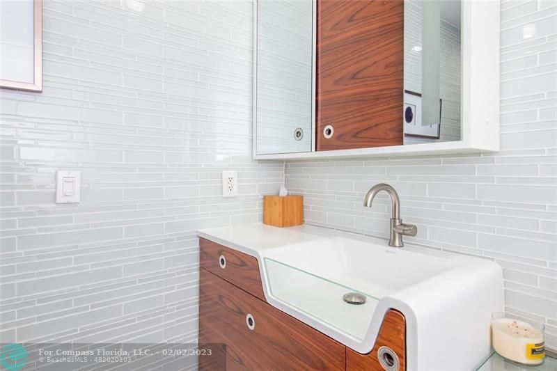 930 Northwest 4th Court Boca Raton, FL 33432 - Photo 15 of 28 a bathroom with a sink and a mirror