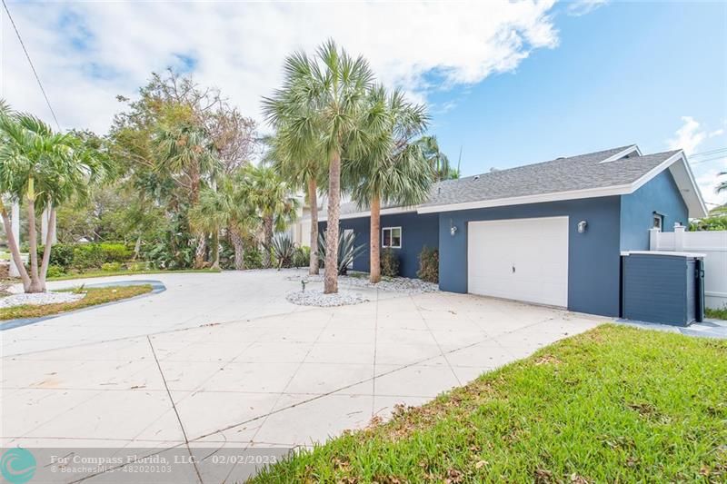 930 Northwest 4th Court Boca Raton, FL 33432 - Photo 2 of 28 a front view of house with yard and trees