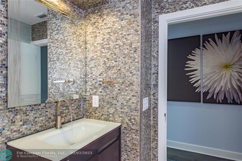 930 Northwest 4th Court Boca Raton, FL 33432 - Photo 21 of 28 a bathroom with a sink and a mirror