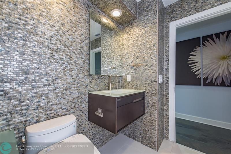 930 Northwest 4th Court Boca Raton, FL 33432 - Photo 22 of 28 a bathroom with a toilet and a sink