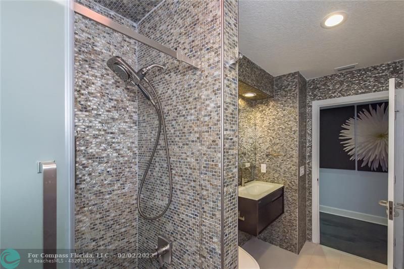 930 Northwest 4th Court Boca Raton, FL 33432 - Photo 23 of 28 a bathroom with a shower and toilet