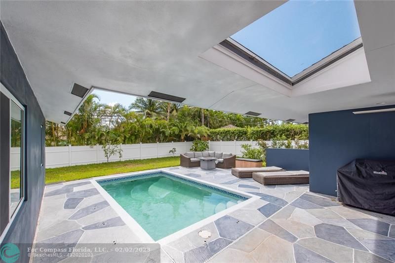 930 Northwest 4th Court Boca Raton, FL 33432 - Photo 25 of 28 a view of swimming pool with chairs and plants