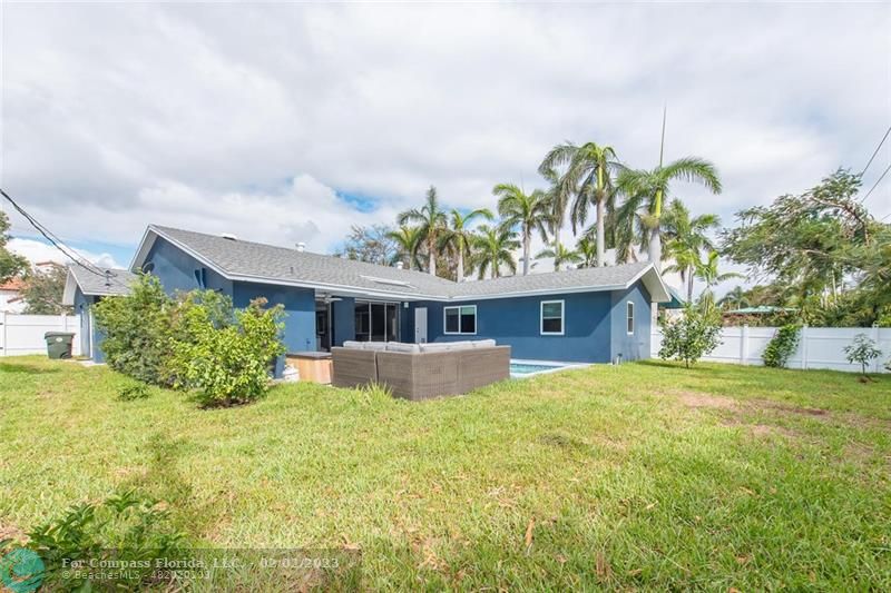 930 Northwest 4th Court Boca Raton, FL 33432 - Photo 26 of 28 a front view of house with yard and trees