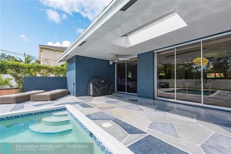 930 Northwest 4th Court Boca Raton, FL 33432 - Photo 27 of 28 a house with yard and a potted plant