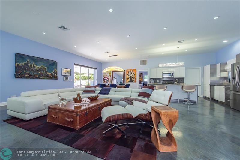 930 Northwest 4th Court Boca Raton, FL 33432 - Photo 8 of 28 a living room with furniture or kitchen view and a wooden floor