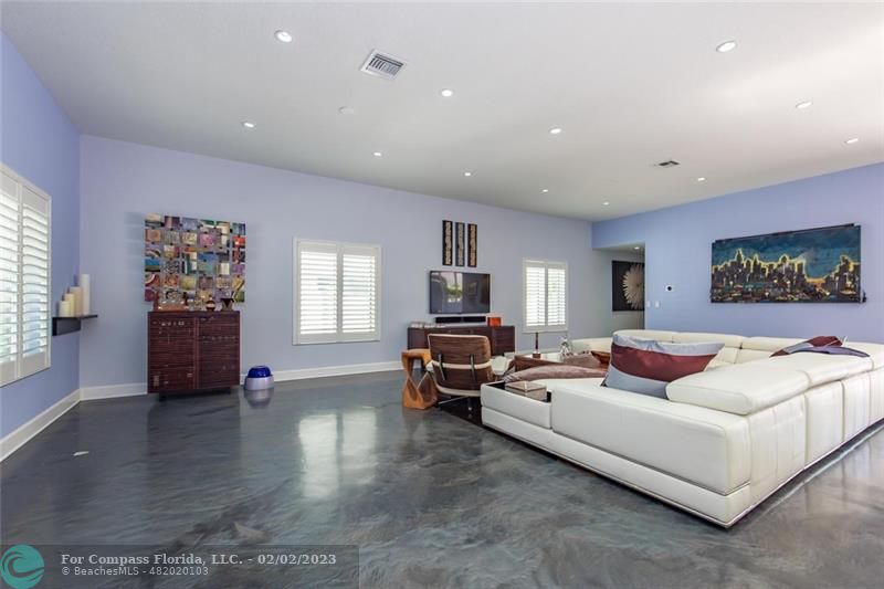 930 Northwest 4th Court Boca Raton, FL 33432 - Photo 10 of 28 a living room with furniture or couch and a flat screen tv