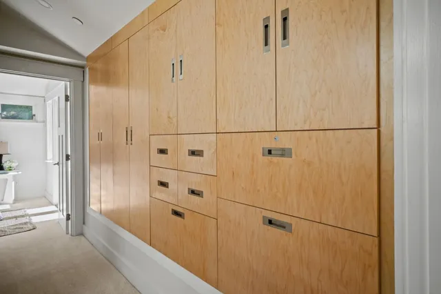 a bedroom with a balcony a bed and a couch