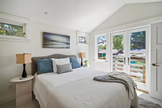 a bedroom with a bed and a cabinets