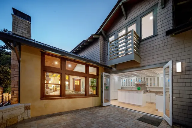 a view of a house with a balcony and door