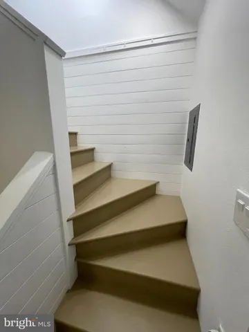 a view of room with window and hardwood floor