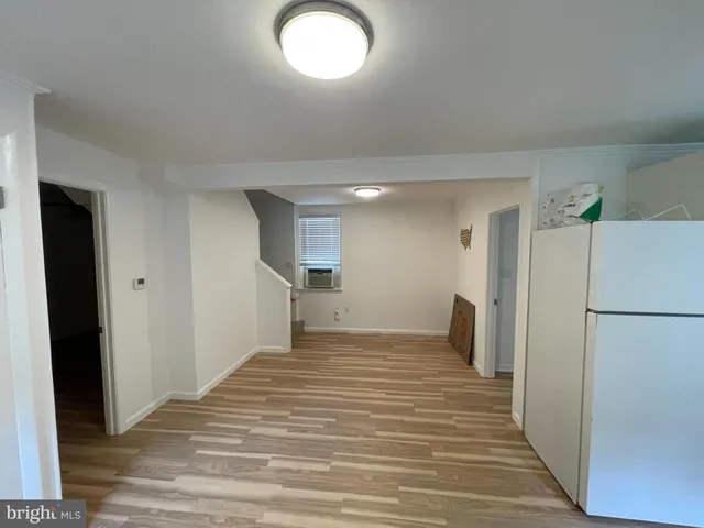a view of a kitchen from a hallway