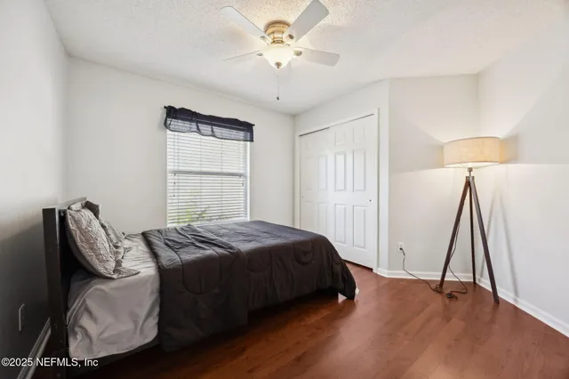 a bathroom with a sink a toilet a shower and a mirror
