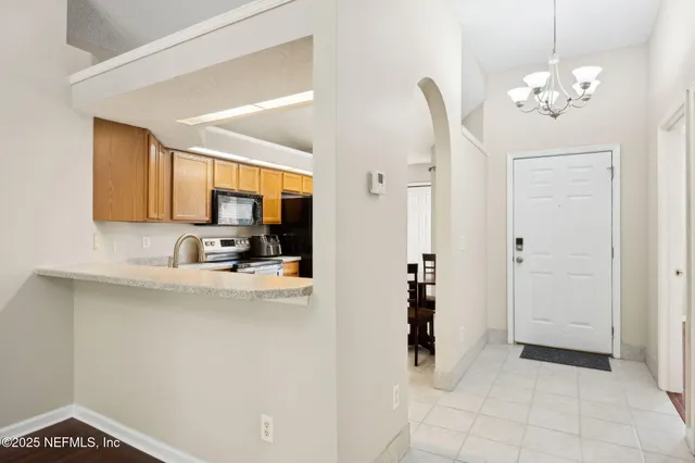 a view of kitchen with kitchen island dining table and chairs