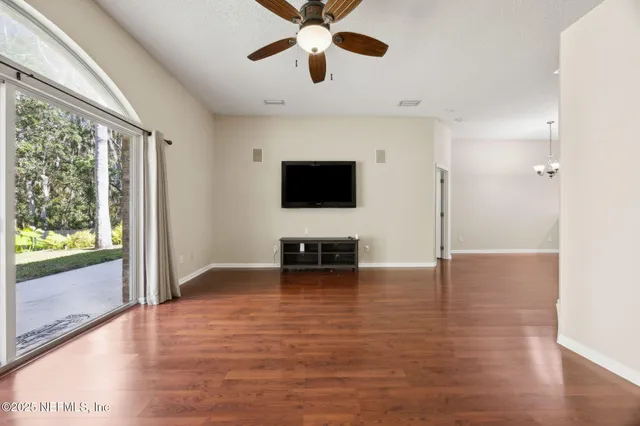 a view of livingroom with hardwood floor and ceiling fan
