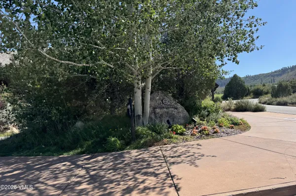 a utility room with a stove and cabinets