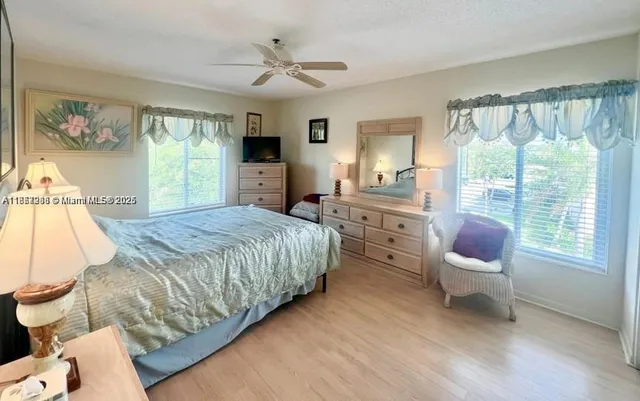 a bed room with a bed and a chair