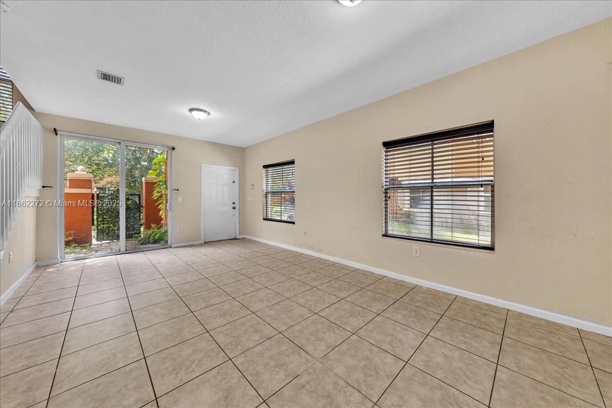 12252 Southwest 25th Court, Unit 1614 Miramar, FL 33025 - Photo 12 of 46 a view of an empty room with a window