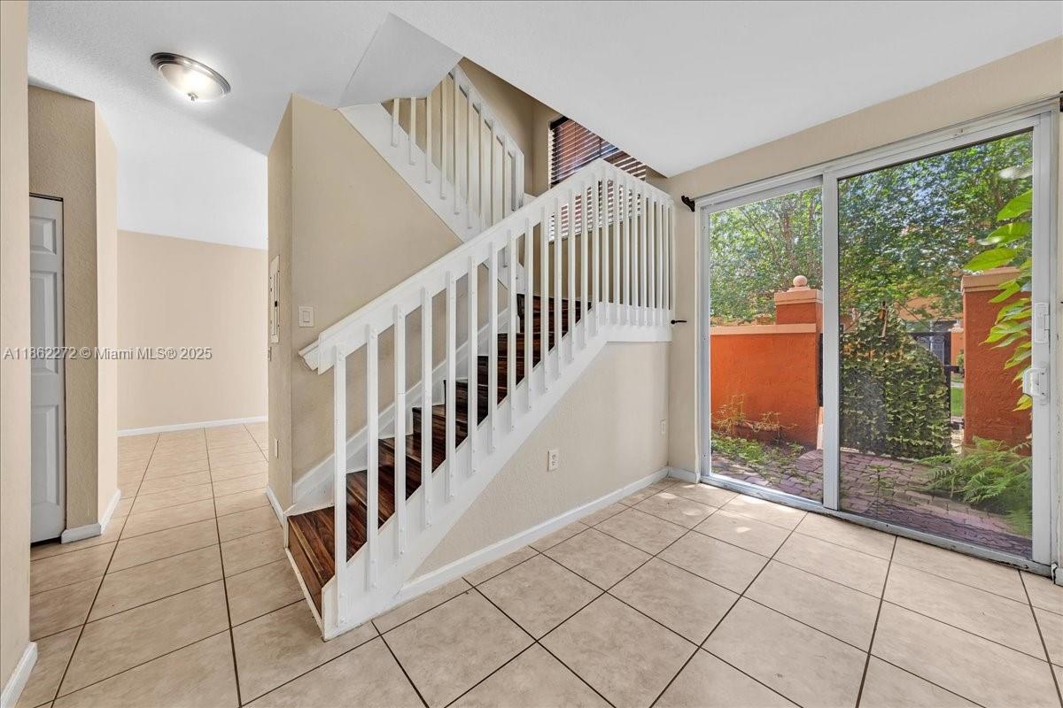 12252 Southwest 25th Court, Unit 1614 Miramar, FL 33025 - Photo 13 of 46 a view of an entryway with staircase