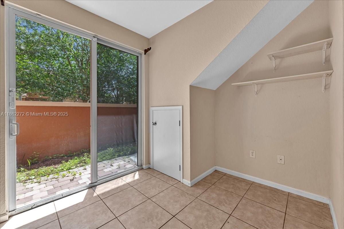 12252 Southwest 25th Court, Unit 1614 Miramar, FL 33025 - Photo 23 of 46 a view of an empty room with a window