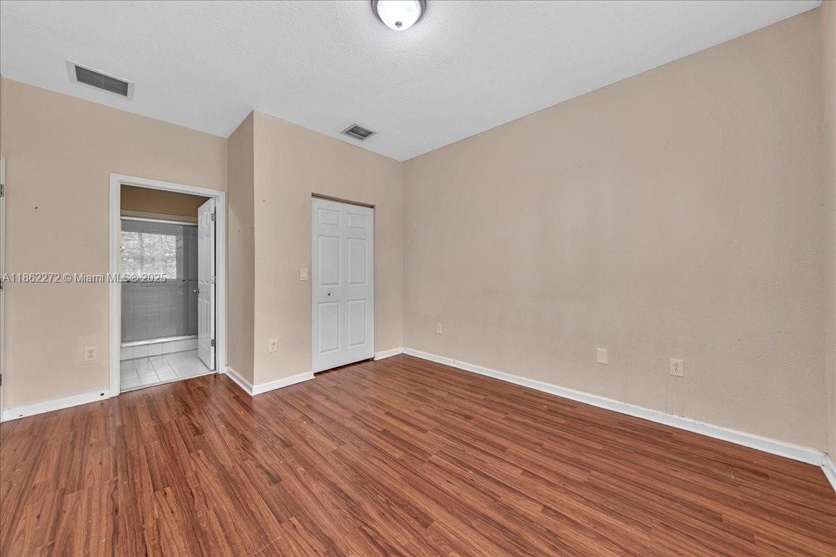 12252 Southwest 25th Court, Unit 1614 Miramar, FL 33025 - Photo 25 of 46 wooden floor in an empty room