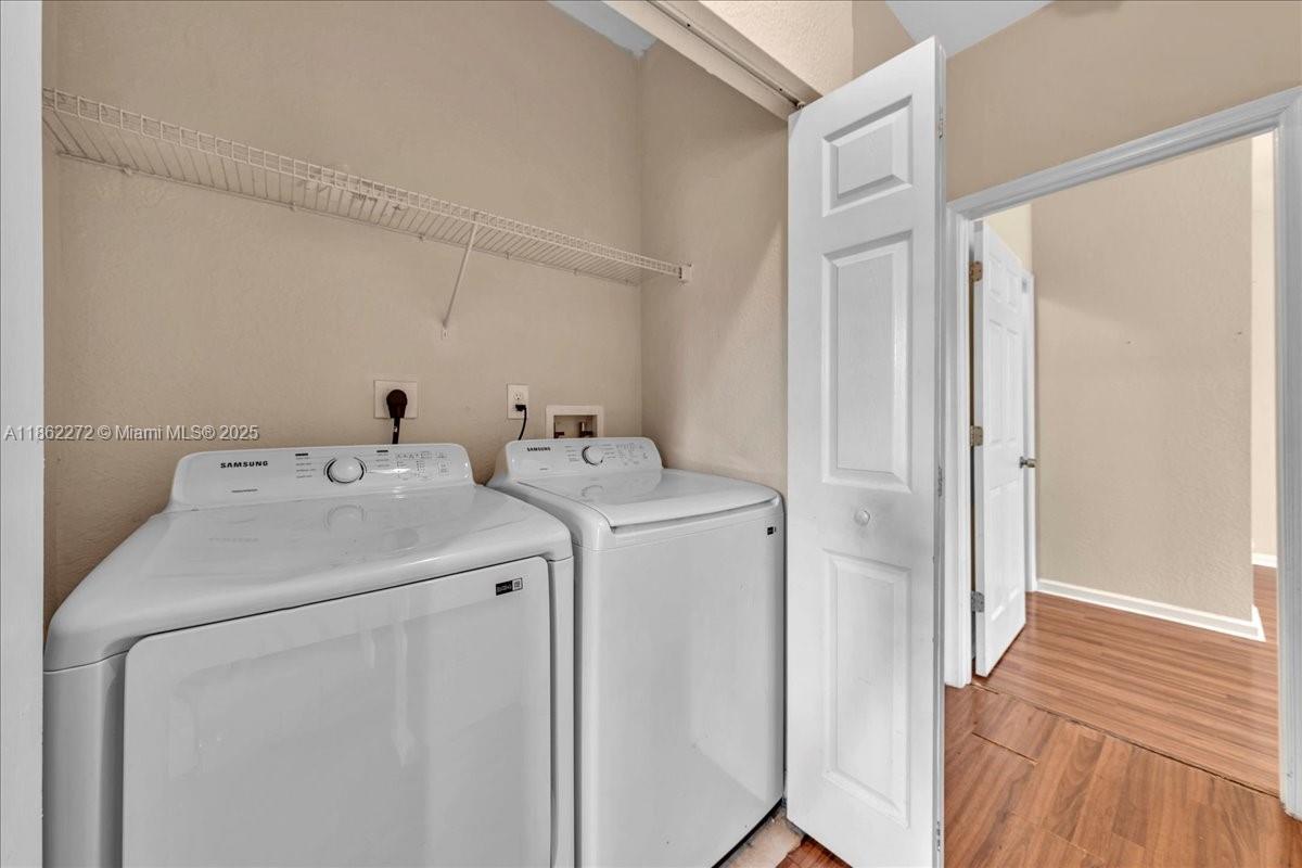 12252 Southwest 25th Court, Unit 1614 Miramar, FL 33025 - Photo 32 of 46 a utility room with dryer and washer