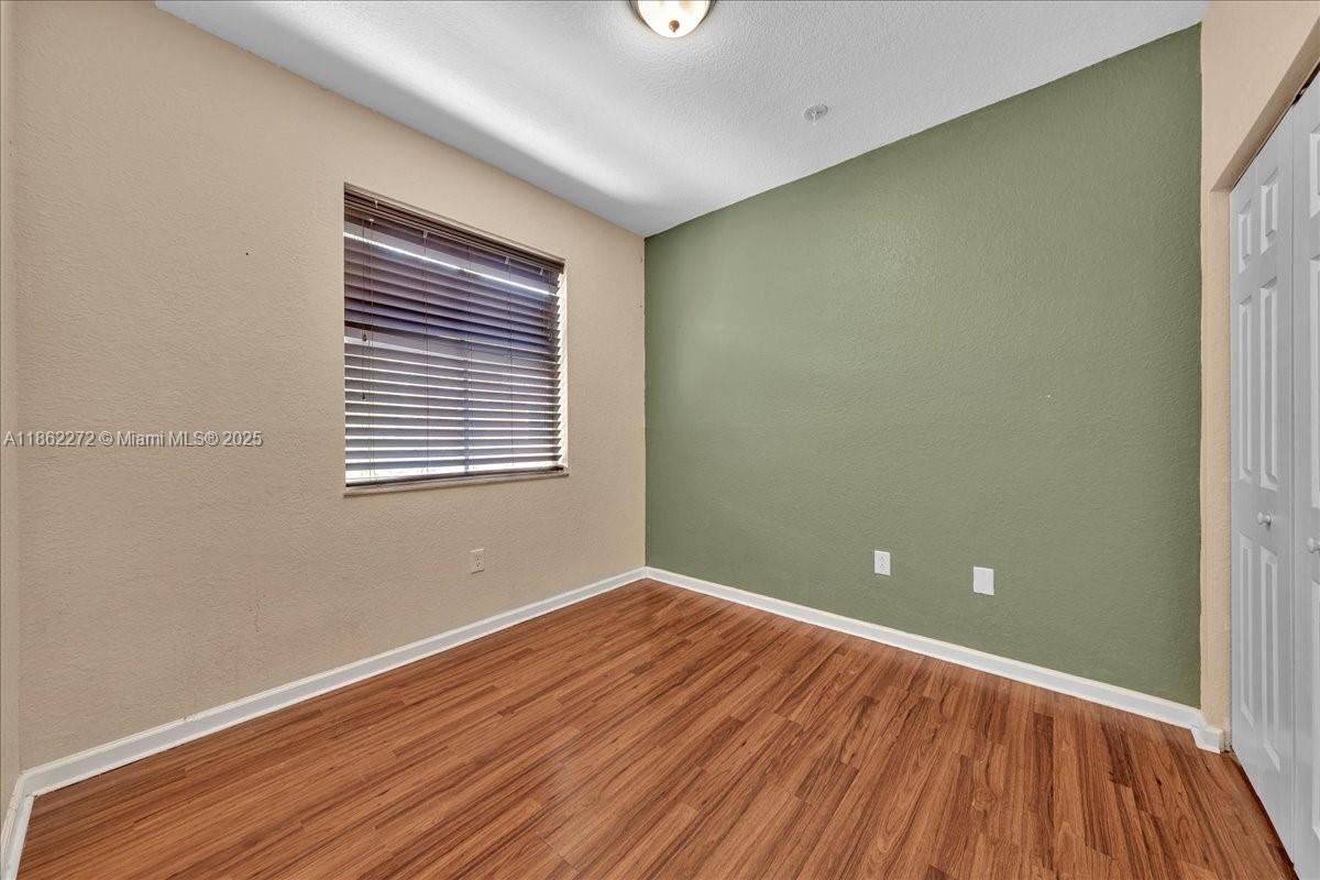 12252 Southwest 25th Court, Unit 1614 Miramar, FL 33025 - Photo 33 of 46 a view of a room with wooden floor and windows