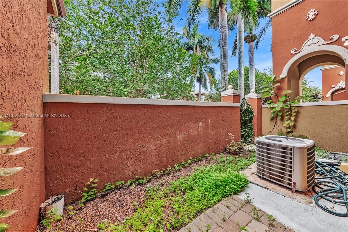 12252 Southwest 25th Court, Unit 1614 Miramar, FL 33025 - Photo 42 of 46 an outdoor view of garden with deck