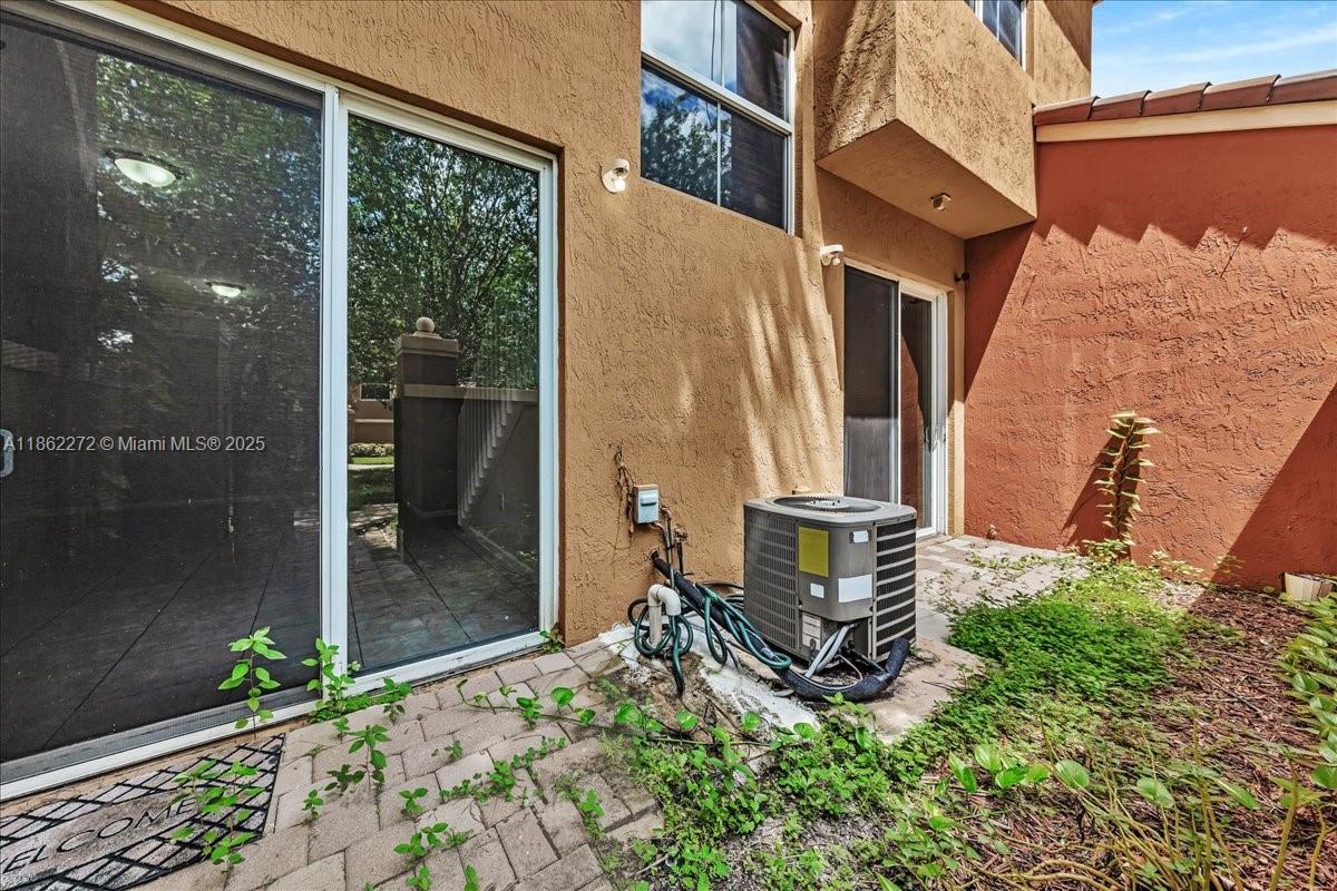 12252 Southwest 25th Court, Unit 1614 Miramar, FL 33025 - Photo 46 of 46 a backyard of a house with garden