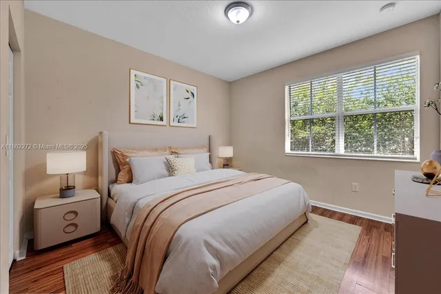 a bedroom with a large bed and a tv