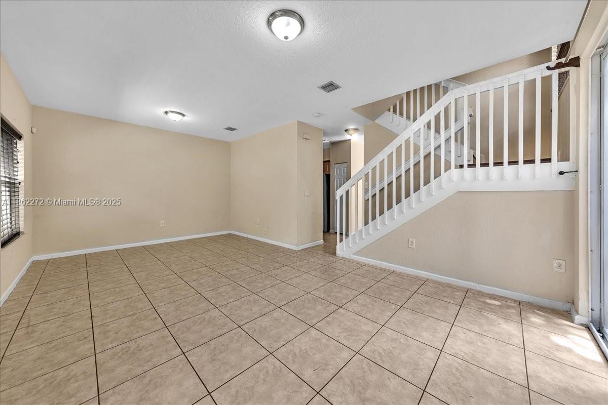 12252 Southwest 25th Court, Unit 1614 Miramar, FL 33025 - Photo 8 of 46 a view of an entryway with stairs
