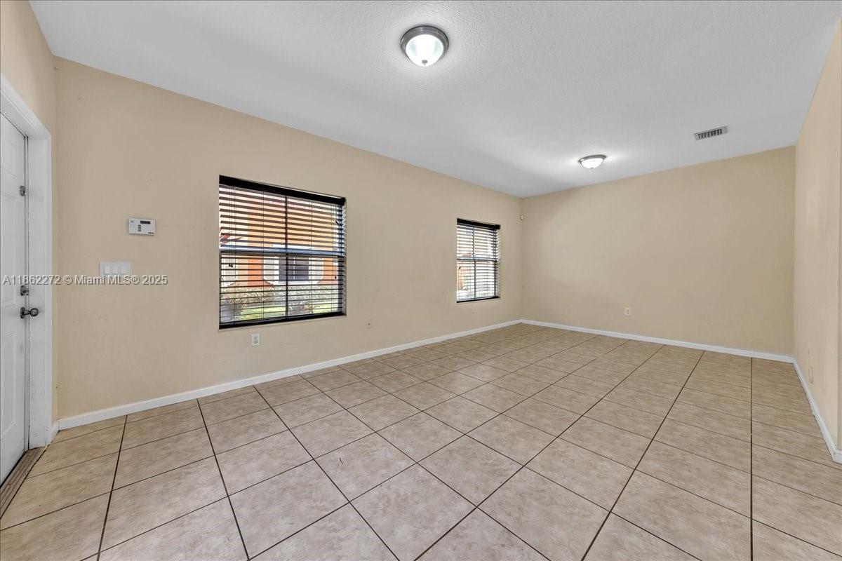 12252 Southwest 25th Court, Unit 1614 Miramar, FL 33025 - Photo 9 of 46 an empty room with windows