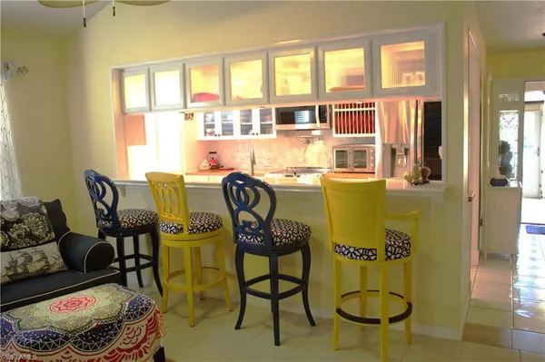 a workspace room with furniture and windows