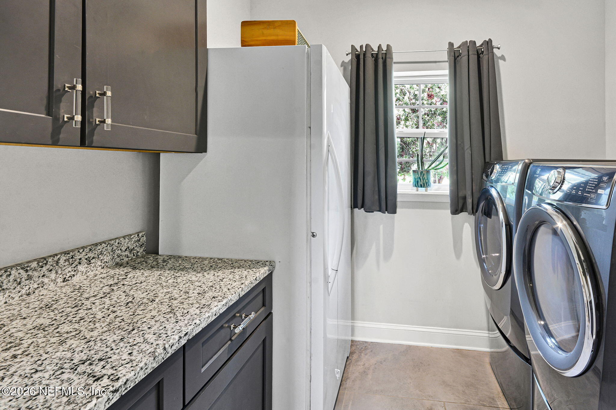 57353 Sandy Oaks Lane Callahan, FL 32011 - Photo 14 of 61 a utility room with dryer and washer