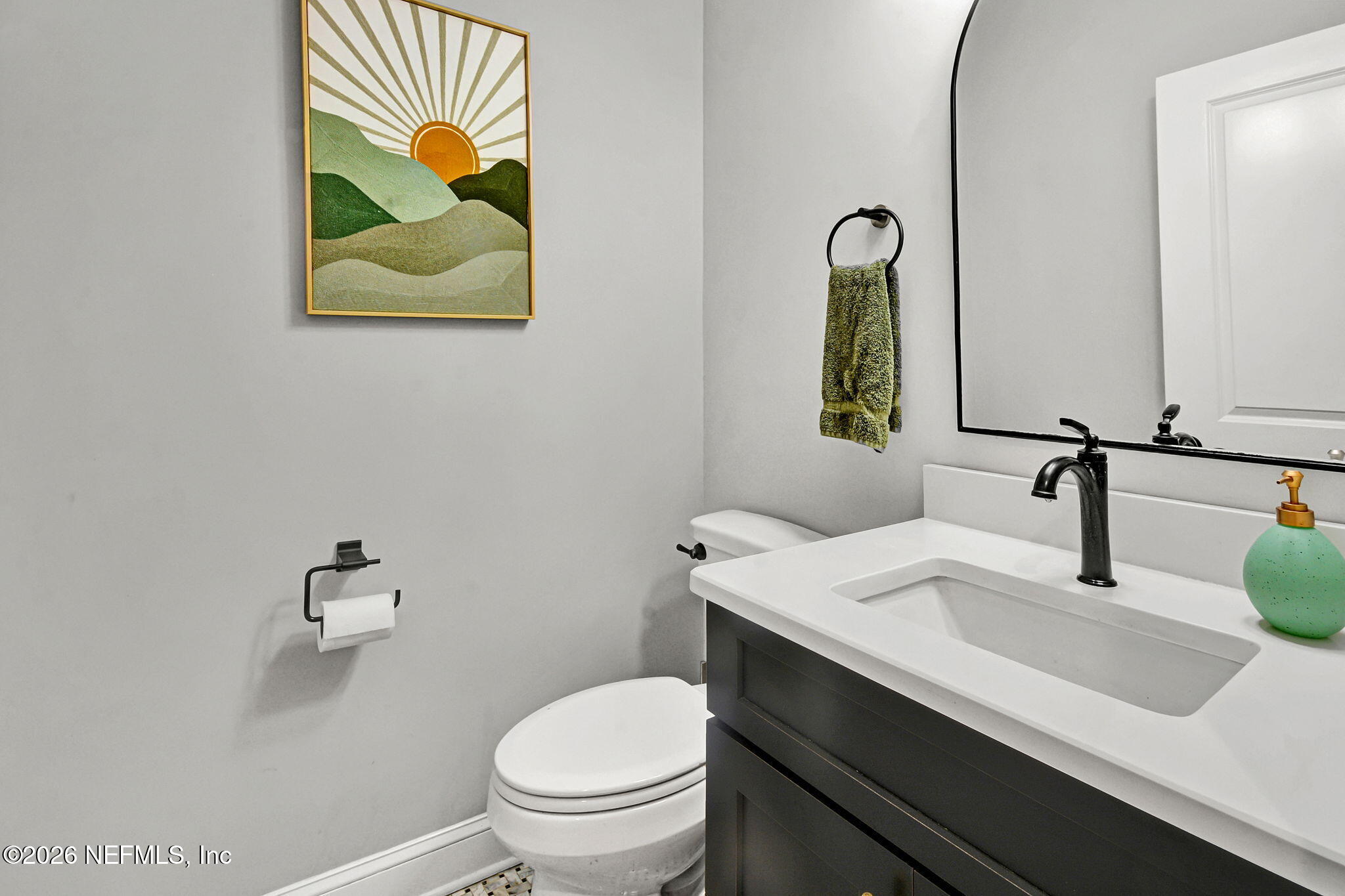 57353 Sandy Oaks Lane Callahan, FL 32011 - Photo 15 of 61 a bathroom with a sink vanity and toilet