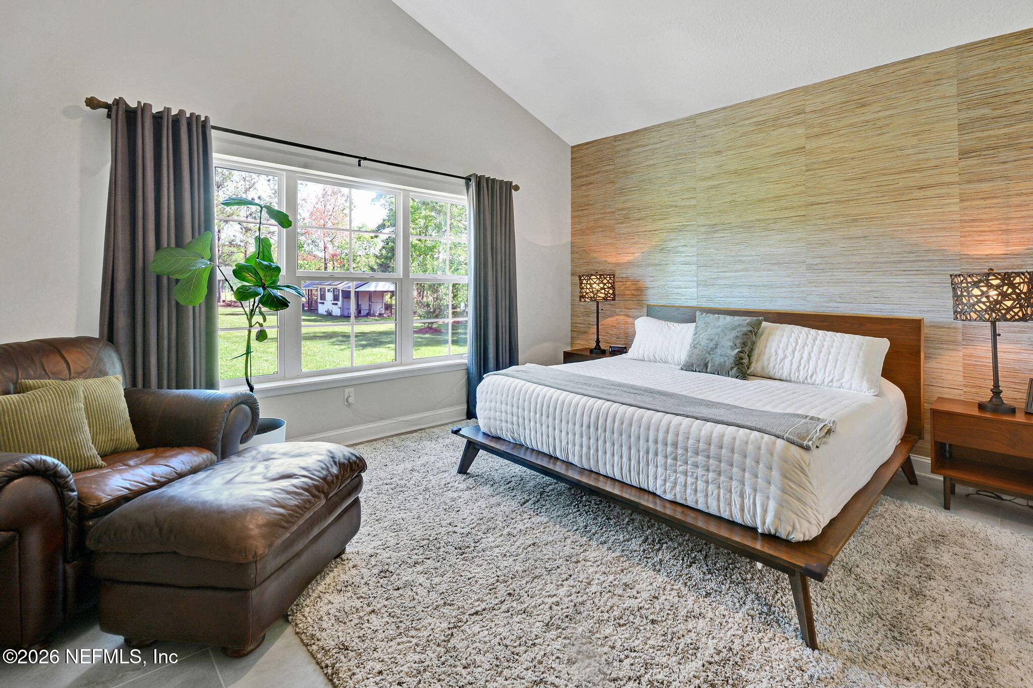57353 Sandy Oaks Lane Callahan, FL 32011 - Photo 17 of 61 a bedroom with a bed couch and window