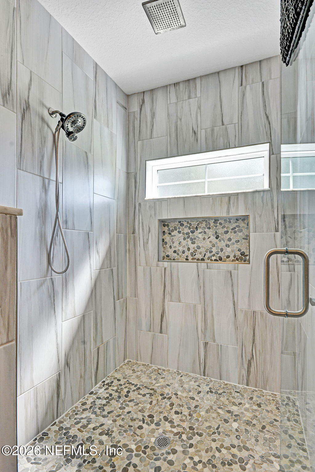 57353 Sandy Oaks Lane Callahan, FL 32011 - Photo 20 of 61 a bathroom with a shower