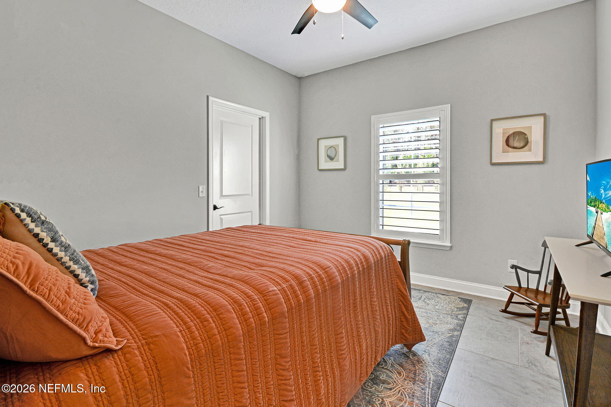 57353 Sandy Oaks Lane Callahan, FL 32011 - Photo 22 of 61 a bedroom with a bed and a chandelier