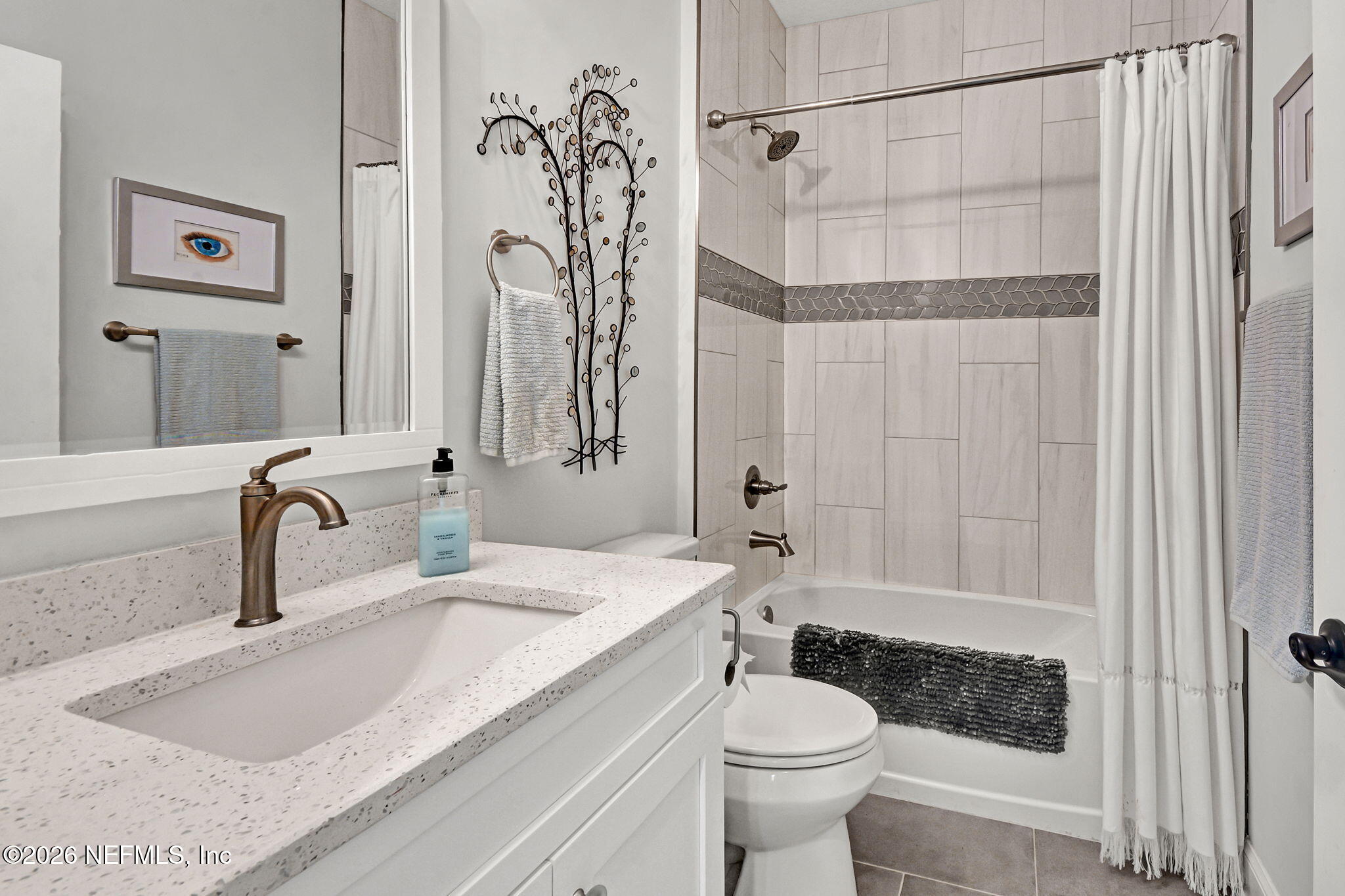 57353 Sandy Oaks Lane Callahan, FL 32011 - Photo 23 of 61 a bathroom with a granite countertop sink toilet and shower