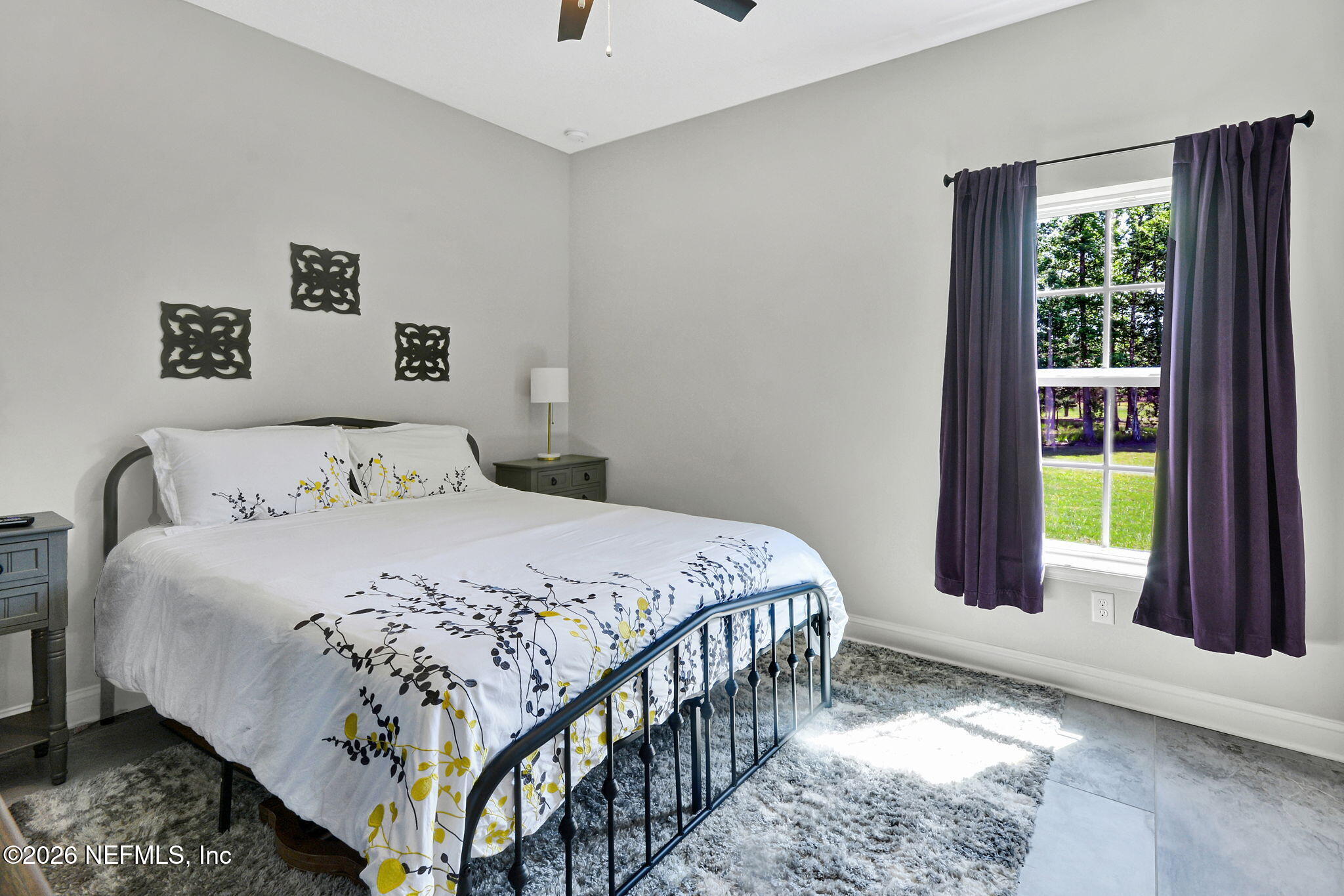 57353 Sandy Oaks Lane Callahan, FL 32011 - Photo 24 of 61 a bedroom with a bed and a window