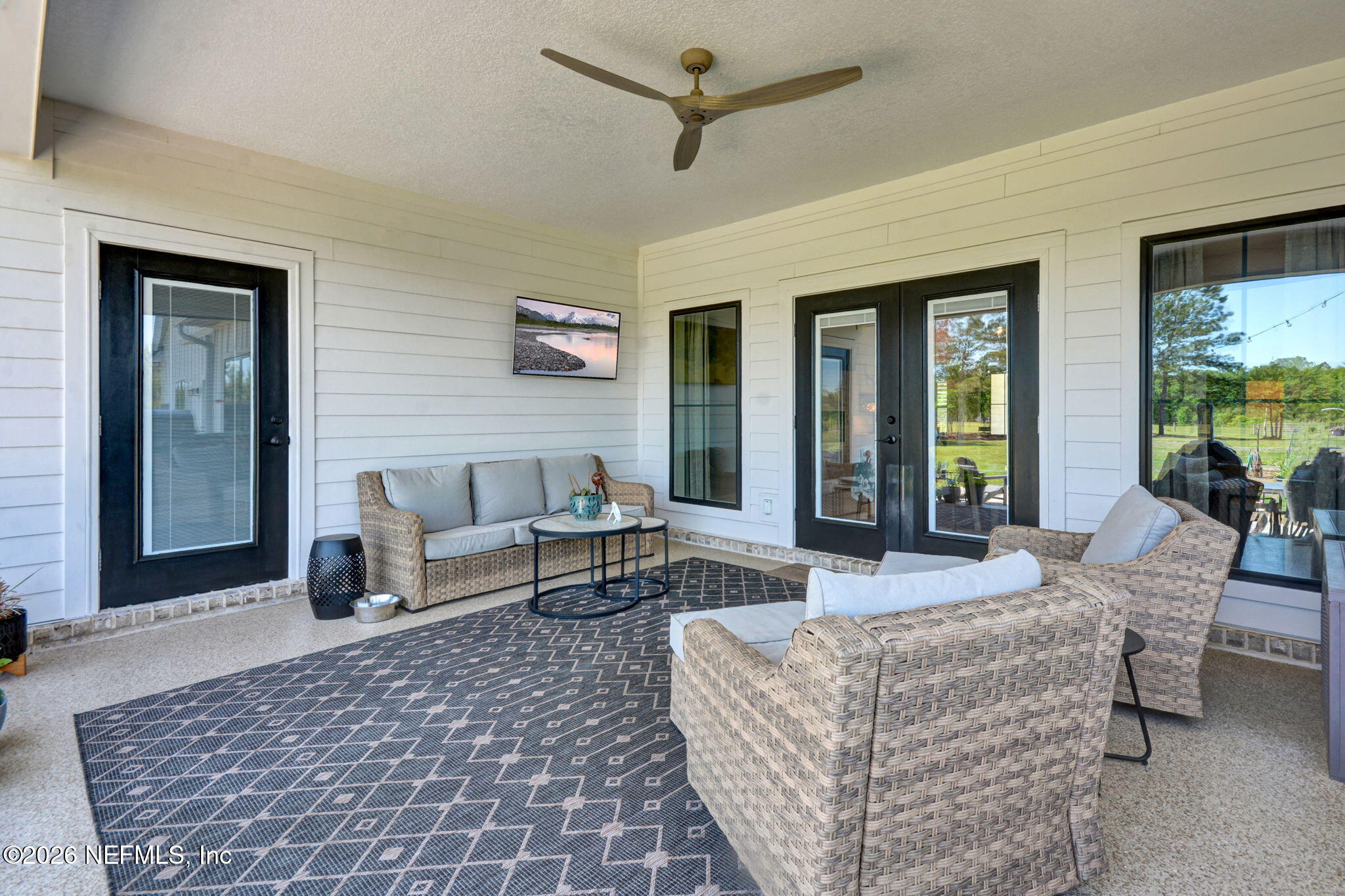 57353 Sandy Oaks Lane Callahan, FL 32011 - Photo 28 of 61 a living room with furniture and a rug