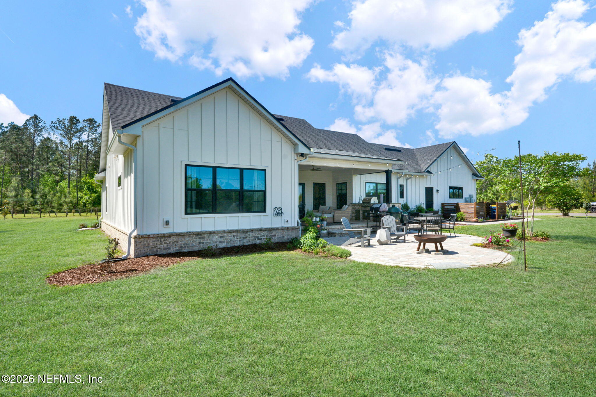 57353 Sandy Oaks Lane Callahan, FL 32011 - Photo 31 of 61 a view of a house with backyard and sitting area
