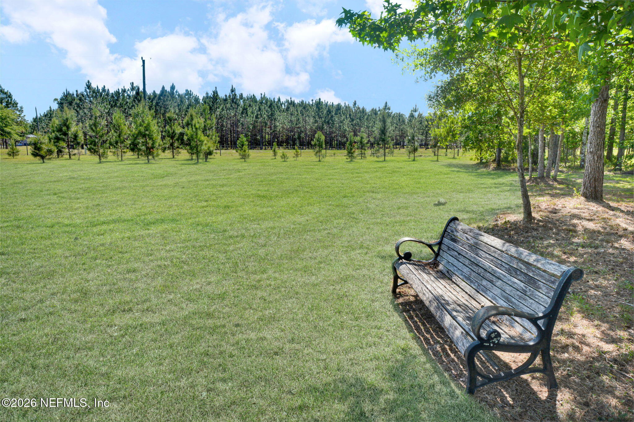 57353 Sandy Oaks Lane Callahan, FL 32011 - Photo 35 of 61 a view of a golf course with chairs