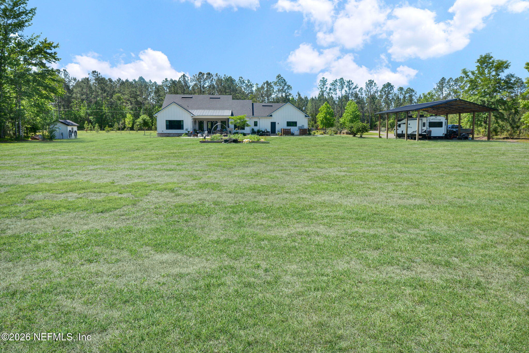 57353 Sandy Oaks Lane Callahan, FL 32011 - Photo 36 of 61 a view of a house with a big yard