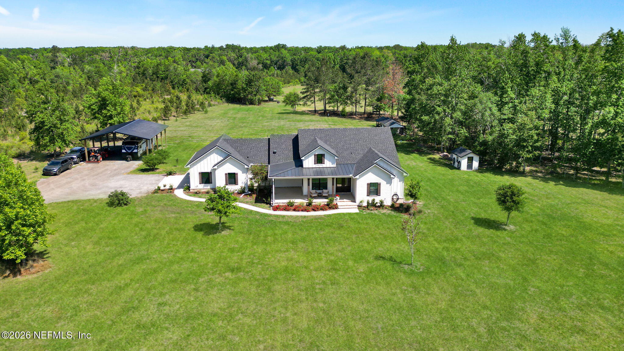 57353 Sandy Oaks Lane Callahan, FL 32011 - Photo 39 of 61 an aerial view of a house with swimming pool and big yard