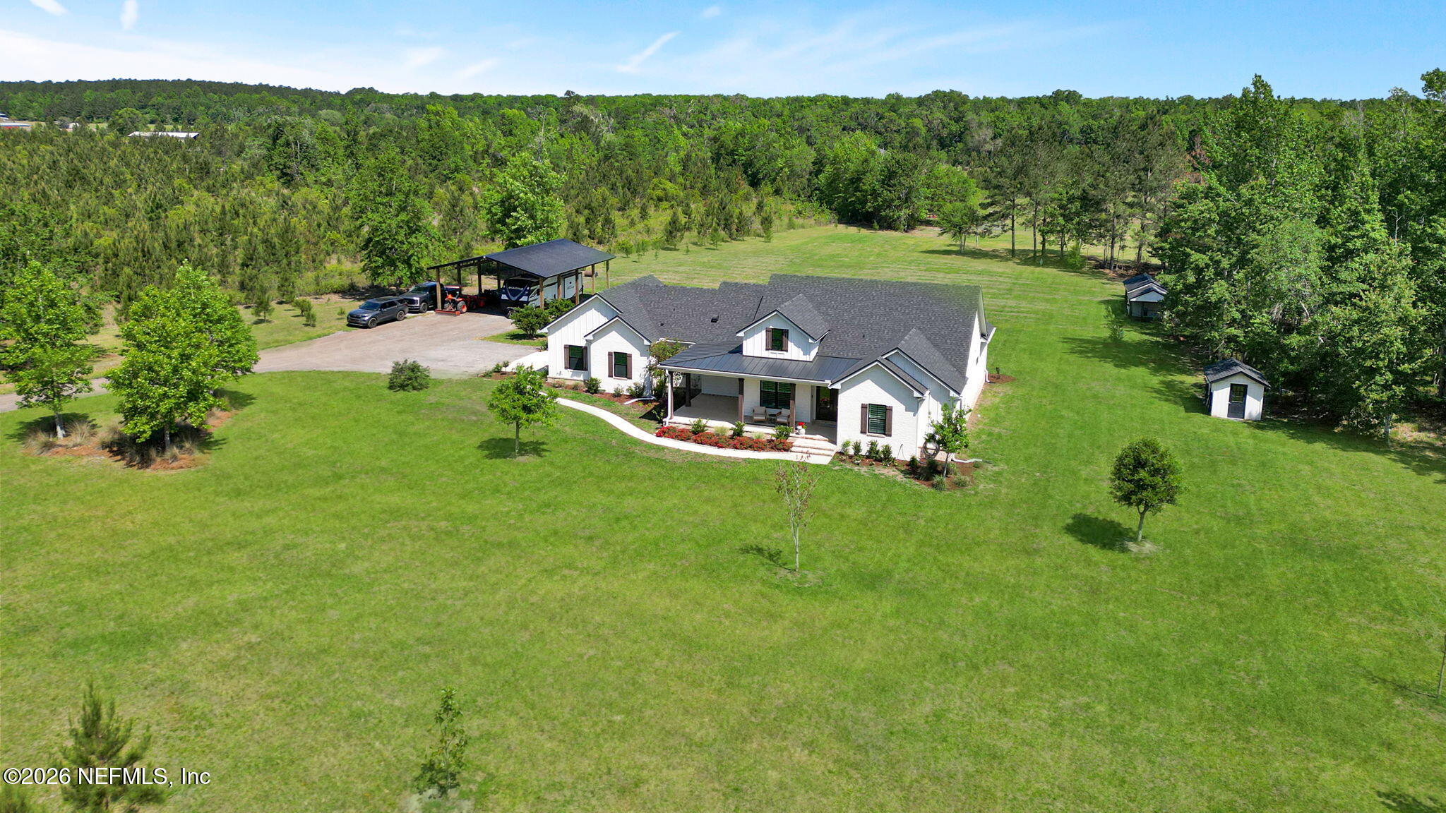 57353 Sandy Oaks Lane Callahan, FL 32011 - Photo 40 of 61 an aerial view of a house with a yard
