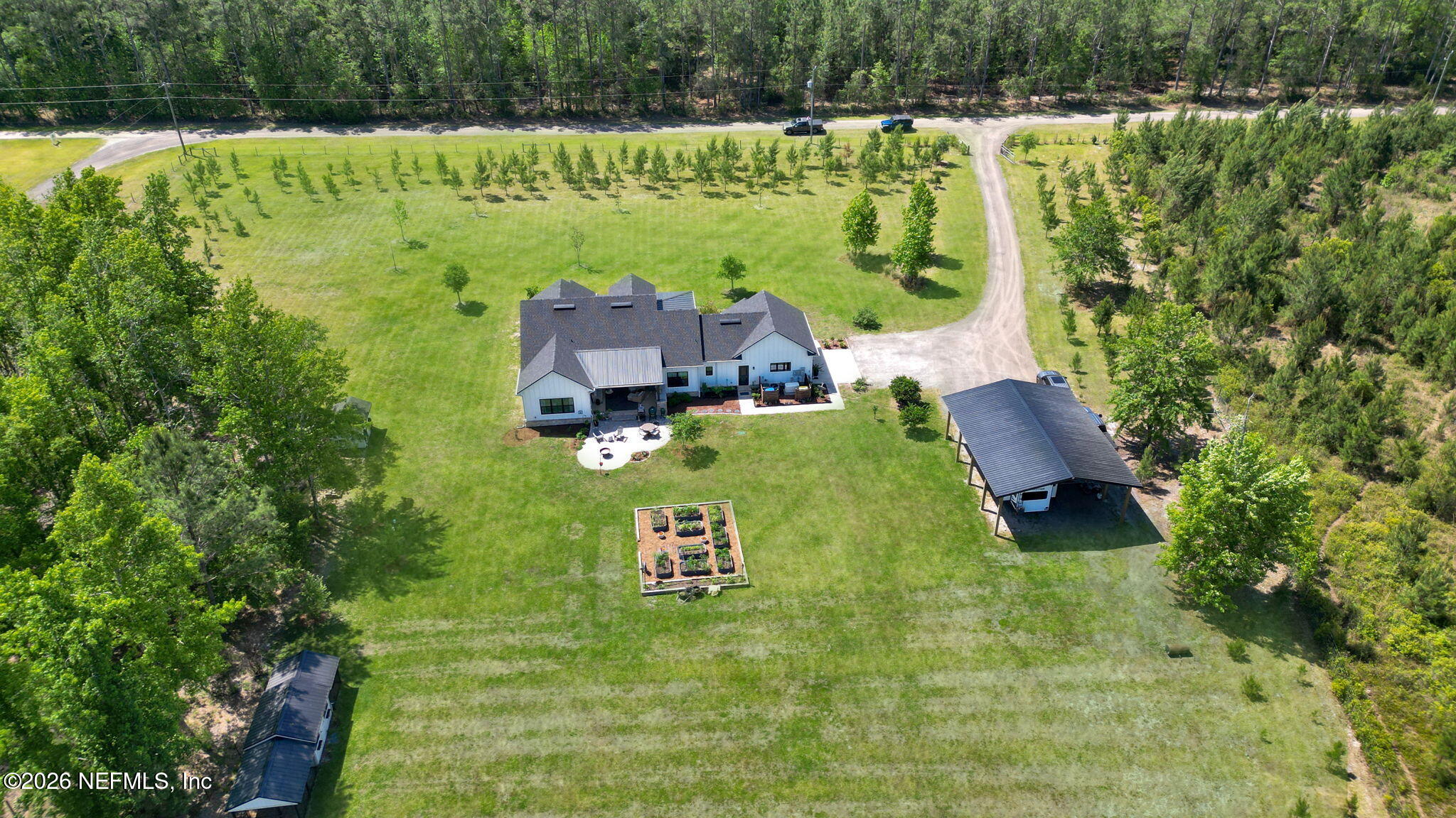 57353 Sandy Oaks Lane Callahan, FL 32011 - Photo 46 of 61 a aerial view of a house with a yard