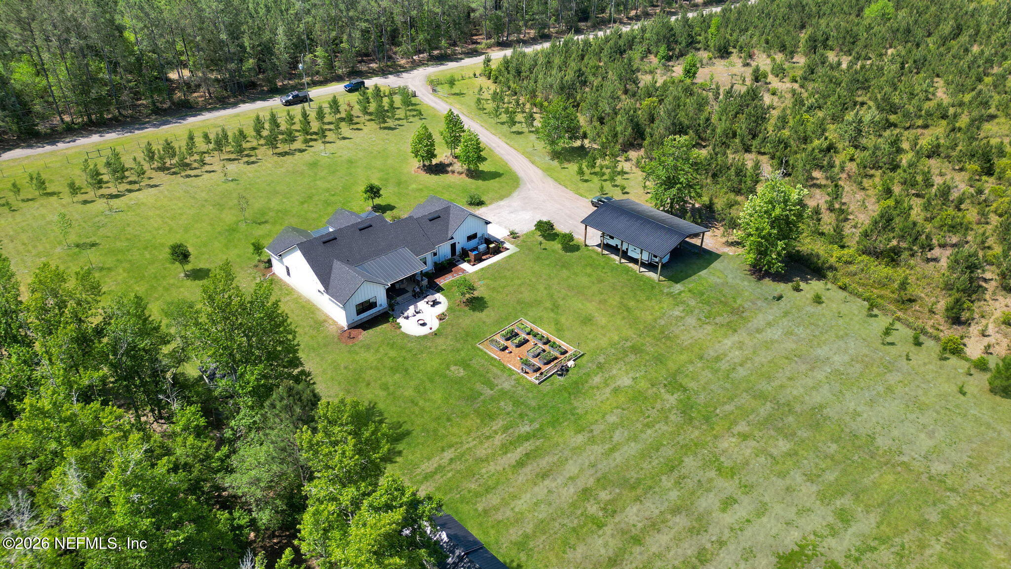 57353 Sandy Oaks Lane Callahan, FL 32011 - Photo 47 of 61 an aerial view of a house with a garden