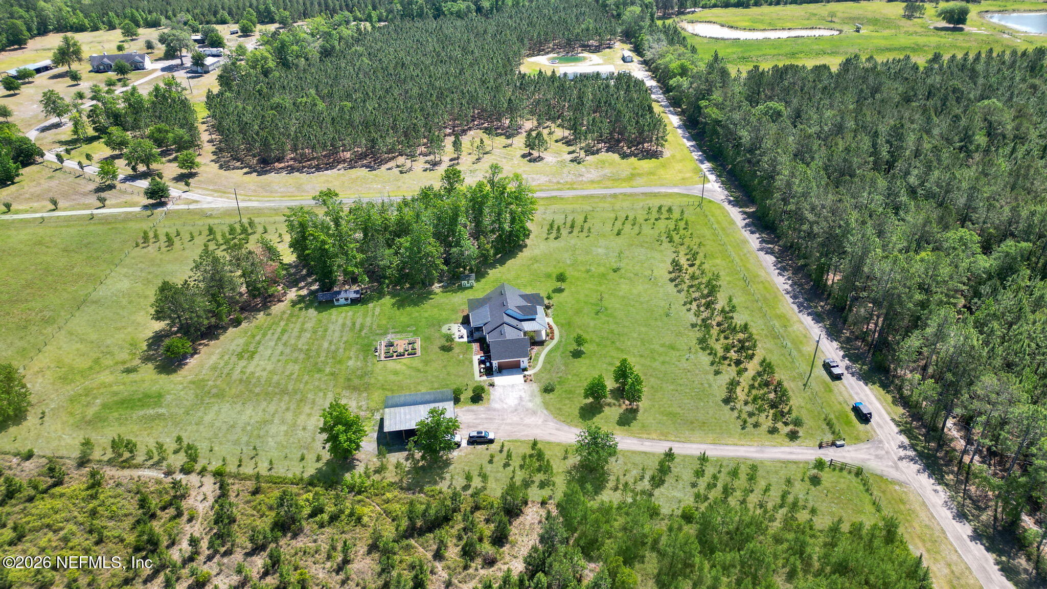 57353 Sandy Oaks Lane Callahan, FL 32011 - Photo 51 of 61 an aerial view of a residential houses with yard